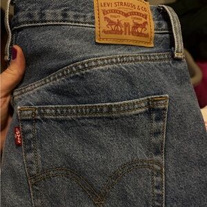 Distressed Blue Denim Jeans